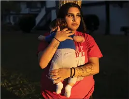  ?? RACHEL BUJALSKI — THE NEW YORK TIMES, FILE ?? Arabella Guevara with her baby Joshias outside her apartment in San Jose in 2022. Released from a Santa Clara County juvenile detention facility in 2020, Guevara now serves as a youth organizer for the Young Women's Freedom Center to help girls avoid jail time.