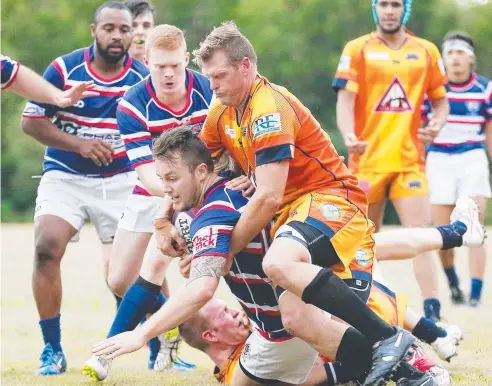  ?? Picture: BRENDAN RADKE ?? MEAT PIE TIME: Ethan Thompson crashes over the tryline for Barron-Trinity during their clash with the Northern Beaches Mudcrabs at Machans Beach on Saturday.