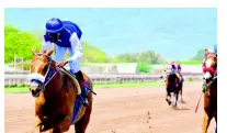  ??  ?? RUN THATCHER RUN (Omar Walker) wins yesterday’s third race at Caymanas Park.