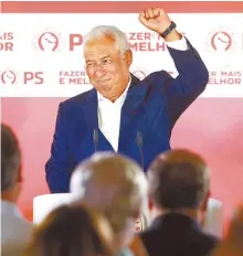  ?? AP-Yonhap ?? Portuguese Prime Minister and Socialist Party leader Antonio Costa celebrates after wining the Portugal election, in Lisbon. Sunday. Portugal’s center-left Socialist Party has collected the most votes in general election, leaving it poised to continue in government for another four years.