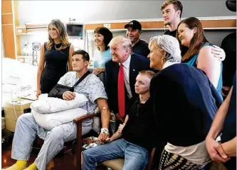  ??  ?? President Trump and first lady Melania Trump meet with victims from Sunday’s mass shooting in Dayton. Miami Valley Hospital would not release the name of the patients.