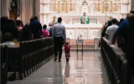  ?? Jessie Wardarski/Associated Press ?? The Very Rev. Kris Stubna leads Mass on June 26 at St. Paul Catholic Cathedral in Pittsburgh. He discarded his planned Sunday homily and focused on the Supreme Court’s decision to overturn the nearly 50-year-old ruling.