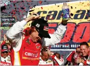  ?? ROSS D. FRANKLIN ?? Matt Kenseth celebrates his win in Victory Lane after a NASCAR Cup Series auto race at Phoenix Internatio­nal Raceway Sunday in Avondale, Ariz.