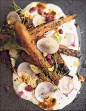  ??  ?? Charred carrots with tzatziki.