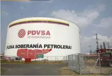  ?? — Reuters ?? An oil tank is seen at PDVSA’S Jose Antonio Anzoategui industrial complex in the state of Anzoategui, Venezuela.