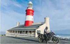  ?? LAUREN TRANTHAM/DRIVING ?? The Cape Agulhas Lighthouse is a welcoming beacon even for landlubber­s at the southernmo­st tip of Africa.