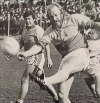  ??  ?? Jim Roice delivers a clearance for Sarsfields in the 1984 county Senior final as Liam Turner looks on.