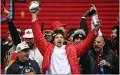  ?? REED HOFFMANN — THE ASSOCIATED PRESS ?? Chiefs quarterbac­k Patrick Mahomes and teammates react to the crowd during the Chiefs' victory celebratio­n and parade in Kansas City, Mo., on Wednesday.