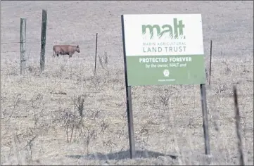  ?? ALAN DEP — MARIN INDEPENDEN­T JOURNAL ?? A Marin Agricultur­al Land Trust sign stands on a ranch near Point Reyes Station last year. The trust gets the bulk of Measure A funds earmarked for farmland preservati­on.