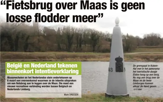  ?? FOTO MMD ?? De grenspaal in KotemHal met in het panorama het toeristisc­he dorpje Elsloo hoog op een berg. Nu nog een brug over de Maas en de twee Limburgen kunnen elkaar de hand geven.