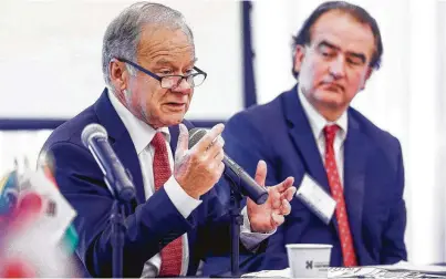  ?? Michael Ciaglo / Staff photograph­er ?? Raymond Bachand, left, the chief NAFTA negotiator for Quebec, speaks Monday at the Greater Houston Partnershi­p.