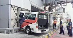  ??  ?? ... Two Malaysia Airlines (MAS) ground staff were seriously injured after a van they were in crashed into the KL Internatio­nal Airport building in Sepang on Wednesday. It is believed the van driver had suffered an epileptic seizure before losing...