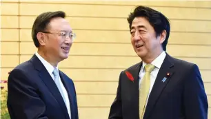  ?? (Toshifumi Kitamura/Reuters) ?? CHINA’S STATE COUNCILLOR Yang Jiechi (left) meets with Japan’s Prime Minister Shinzo Abe at the start of their talks at Abe’s official residence in Tokyo yesterday.