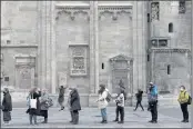  ?? LISA LEUTNER — THE ASSOCIATED PRESS ?? People line up for vaccinatio­n in front of the St. Stephen’s Cathedral in Vienna, Austria, on Friday.