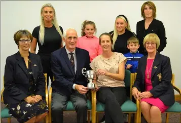  ??  ?? Con Dowdall presenting the Irene Dowdall Memorial Trophy for Wexford lady golfer of the year to Ruth Kennedy, with Martina Gately (lady Captain), Bridget O’Neill (lady President), and members of the Dowdall family looking on.