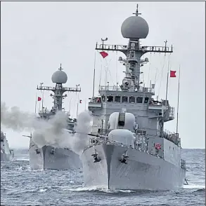  ?? AP/South Korean Defense Ministry ?? A South Korean warship fires a salvo Tuesday during exercises in South Korea’s East Sea in a second straight day of a display of force in reaction to North Korea’s weekend nuclear test.