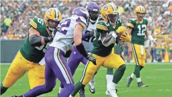  ?? DAN POWERS / USAT ?? Packers running back Jamaal Williams breaks away for a touchdown against the Vikings. It was one of three early touchdowns for the Packers.