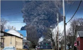  ?? Photograph: Gene J Puskar/AP ?? A black plume rises over East Palestine, Ohio, as a result of a controlled detonation of a portion of the derailed Norfolk Southern train on 6 February.