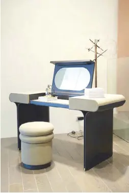  ?? ?? Vintage meets modern: Stami desk/vanity and pouf designed by Studiopepe for Gallotti & Radice; Bolle floor lamp