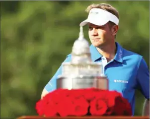  ?? AFP ?? Billy Hurley III looks on behind the trophy after winning the National at the Congressio­nal Country Club in Bethesda, Maryland, on Sunday.