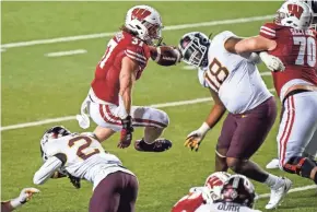  ?? ASSOCIATED PRESS ?? UW tailback Garrett Groshek rushed for 154 yards and a touchdown against Minnesota. He may return to Wisconsin for a sixth year.