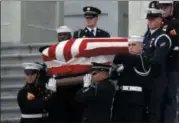  ?? ALEX BRANDON - THE ASSOCIATED PRESS ?? The flag-draped casket of former President George H.W. Bush is carried by a joint services military honor guard from the U.S. Capitol, Wednesday, Dec. 5, 2018, in Washington.