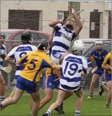  ??  ?? Killavulle­n’s Oisin Larkin goes highest in the crowded goalmouth area to fetch the ball in the Under 16 Championsh­ip final.