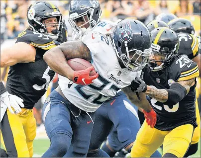  ?? AP PHOTO ?? Tennessee Titans running back Derrick Henry runs the ball as Pittsburgh Steelers defensive back Joe Haden, right, and linebacker Anthony Chickillo pursue during NFL pre-season action Saturday in Pittsburgh.