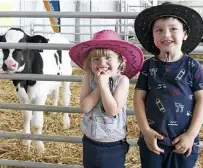  ?? ?? Ivy Watson, 2, and Cooper Watson, 4 from Longwarry with Happy the calf at Farm World last year. Happy the calf will be celebratin­g his first birthday on Saturday in the animal zone at Farm World.