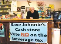  ?? PHOTOS BY CLYDE MUELLER/THE NEW MEXICAN ?? Johnnie Armijo, the 87-year-old owner of Johnnie’s Cash Store, says that if the proposed Santa Fe soda tax passes he will go broke. Armijo opened the store with his grandfathe­r in 1946 at the age of 16.