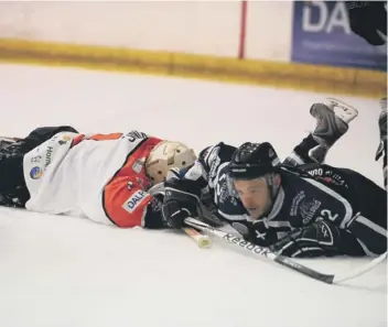  ?? ?? Phantoms netminder Damien King ( left) received rough treatment from Sheffield last weekend. Here he was wiped out by Steeldogs man Lloyd Gibson.