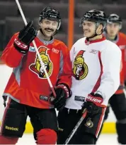  ?? WAYNE CUDDINGTON/OTTAWA CITIZEN ?? Chris Phillips, left, shown with Mark Borowiecki at practice earlier this week, is closing in on 1,100 NHL games. He’s set to hit that mark on Tuesday against the Florida Panthers.
