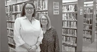  ?? Daniel Bell ?? Assistant Branch Manager Elizabeth Howard, left, and Branch Manager Nyala Edwards pose in the Calhoun-Gordon County Library.