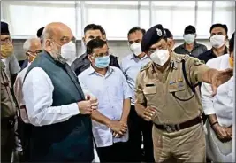  ?? PIC/MPOST ?? Delhi Chief Minister Arvind Kejriwal with Home Minister Amit Shah visits Sardar Patel COVID Care Centre and Hospital, in New Delhi, Saturday