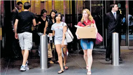  ?? Photo / Bloomberg ?? Workers leave after Lehman Brothers files for bankruptcy in 2008 — and the era of cheap money gets under way.