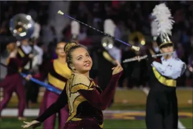  ?? ERIC BONZAR — THE MORNING JOURNAL ?? Sophomore majorette Megan Graves performs with the Avon Lake High School Marching Band during the Shoremen’s road game Sept. 8, against the Avon Eagles.