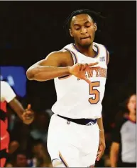  ?? Jessie Alcheh / Associated Press ?? Knicks guard Immanuel Quickley reacts after making a 3-point shot against the Raptors on Sunday.