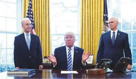  ?? AFP ?? US President Donald Trump, with Vice-President Mike Pence (right) and Health and Human Services Secretary Tom Price (left). Trump’s embattled health minister was forced to leave the US administra­tion on Friday amid a scandal over his use of costly...