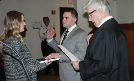  ?? SUBMITTED PHOTO ?? Benjamin Brunner, the newest Plymouth Township police officer, is sworn in.