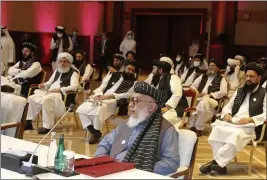  ?? HUSSEIN SAYED — THE ASSOCIATED PRESS FILE ?? On Sept. 12, Taliban negotiator Abbas Stanikzai, center front, and his delegation attend the opening session of peace talks between the Afghan government and the Taliban in Doha, Qatar.