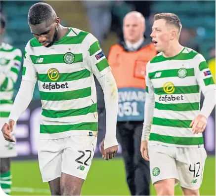  ??  ?? Odsonne Edouard and Callum McGregor dejectedly troop off the field after the 2-0 defeat by Valencia