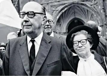  ??  ?? Well versed: Philip Larkin in 1984 with his muse and mistress Monica Jones at the memorial service for John Betjeman. Left: T S Eliot, whose letters are beginning to reveal a different side to his reputed nature