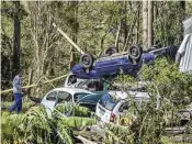  ?? WESLEY SANTOS / AP ?? Cars are destroyed after floods caused by a deadly cyclone in Mucum, Rio Grande do Sul state, Brazil, on Wednesday. An extratropi­cal cyclone in southern Brazil caused floods in several cities.