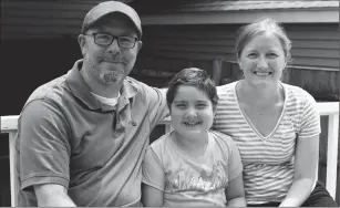  ?? Melissa Bailey/Kaiser Health News ?? Dan and Megan Kelley care for daughter Bridget, 8, who has leukemia, at home in Quincy, Mass. When Bridget was discharged from the hospital after treatment, it "felt like bringing a newborn baby home," Megan Kelley says.