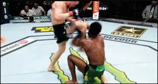  ?? Photo: AFP ?? Yan’s illegal knee strike during UFC 259 against Aljamain Sterling.