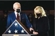  ?? ERIN SCHAFF/THE NEW YORK TIMES VIA AP, POOL ?? President Joe Biden and first lady Jill Biden pay their respects to the late U.S. Capitol Police officer Brian Sicknick as an urn with his cremated remains lies in honor at the Capitol Rotunda on Tuesday.