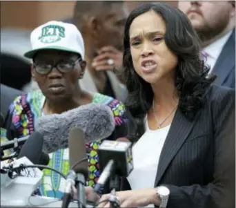  ?? SteVe RUARK — tHe ASSOCiAteD PReSS ?? Baltimore State’s Attorney Marilyn Mosby, right, holds a news conference near the site where Freddie Gray was arrested, after her office dropped the remaining charges against three Baltimore police officers awaiting trial in Gray’s death, in Baltimore,...