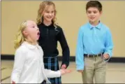  ?? ERIC BONZAR — THE MORNING JOURNAL ?? Classmates Alexa Lyczkowski, 10, and Zane Lassen, 10, look on as St. Mary Catholic School fifth-grader Ava Lyczkowski, 10, auditions Jan. 9, for a part in the upcoming Missoula Children’s Theatre Company production of Joseph Jacobs’ fairy tale “Jack...