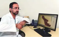  ?? Atiq ur Rehman/Gulf News ?? Dr Khalid Abdullah Al Awadi explains the complex process of how an amputated forearm is reattached.