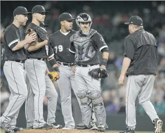  ?? STEPHEN BRASHEAR/GETTY IMAGES ?? Limiting the number of visits to the mound by catchers is just one of several proposals being discussed in an attempt to quicken the pace of MLB play. Other measures include a pitch clock and restoring the lower edge of the strike zone from just...